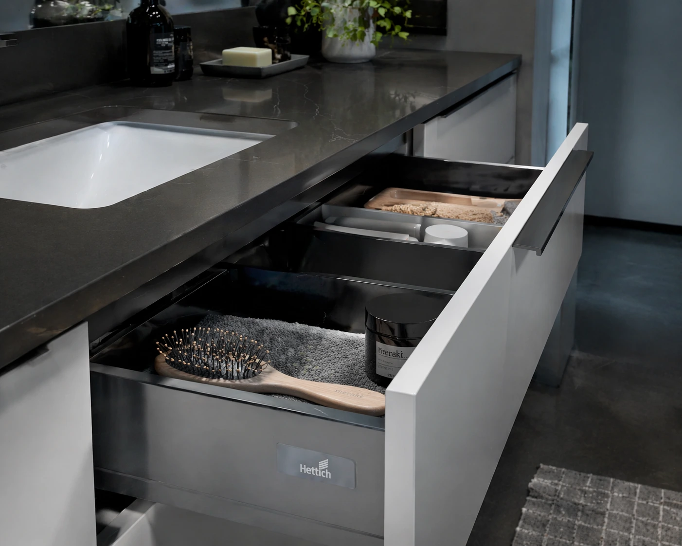 Bathroom vanity with quartz countertop and soft-close drawer showing organized storage compartments